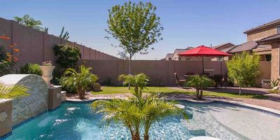 Backyard pool with waterfall of a home in Scottsdale, AZ