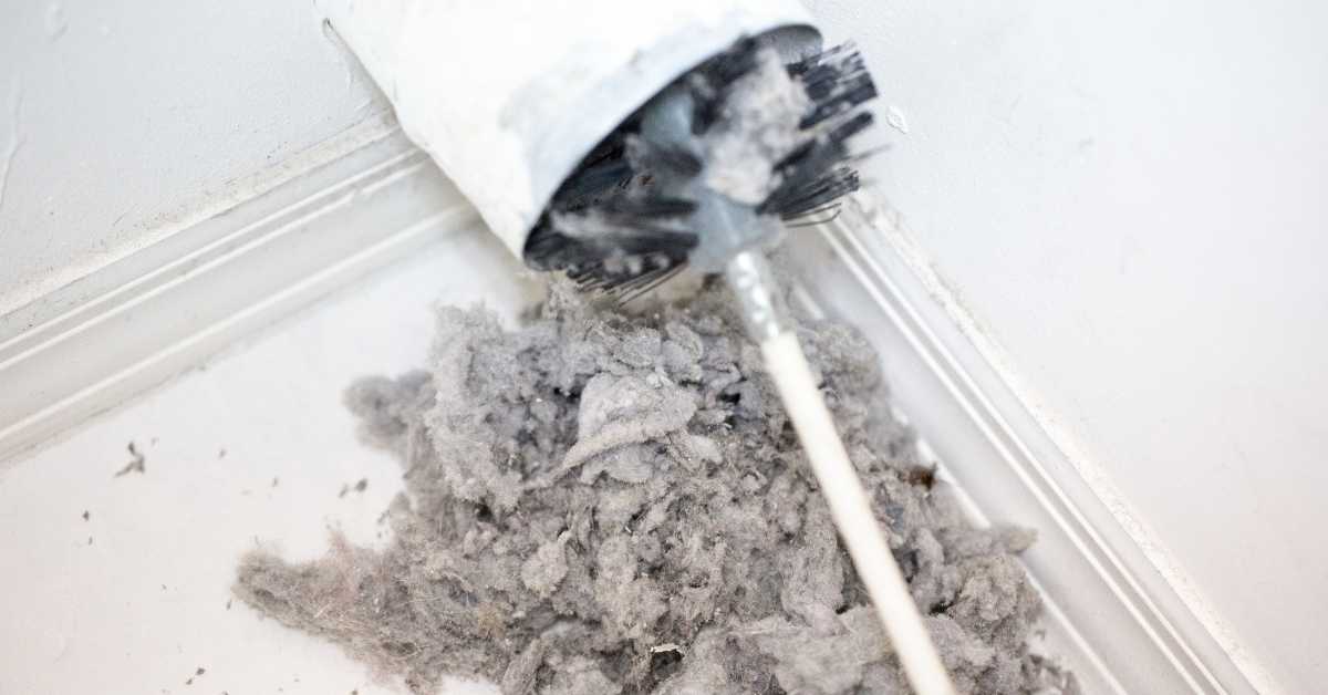 Cleaning a dryer vent with a brush