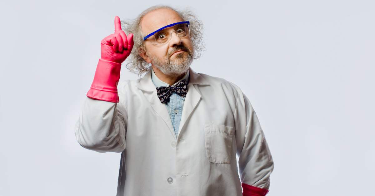 Crazy looking scientist wearing a pink rubber glove