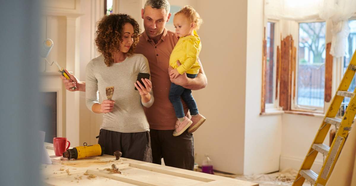 Parents and child renovating a door and windows from the kitchen of their home in Scottsdale.