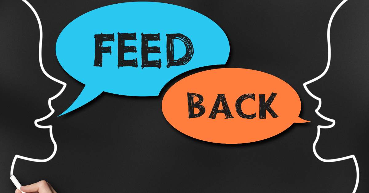 The word feed back in bubbles between 2 drawn silhouettes