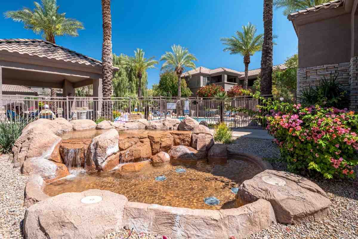 Beautiful fountain in front of the pool area of a Scottsdale condominium for sale