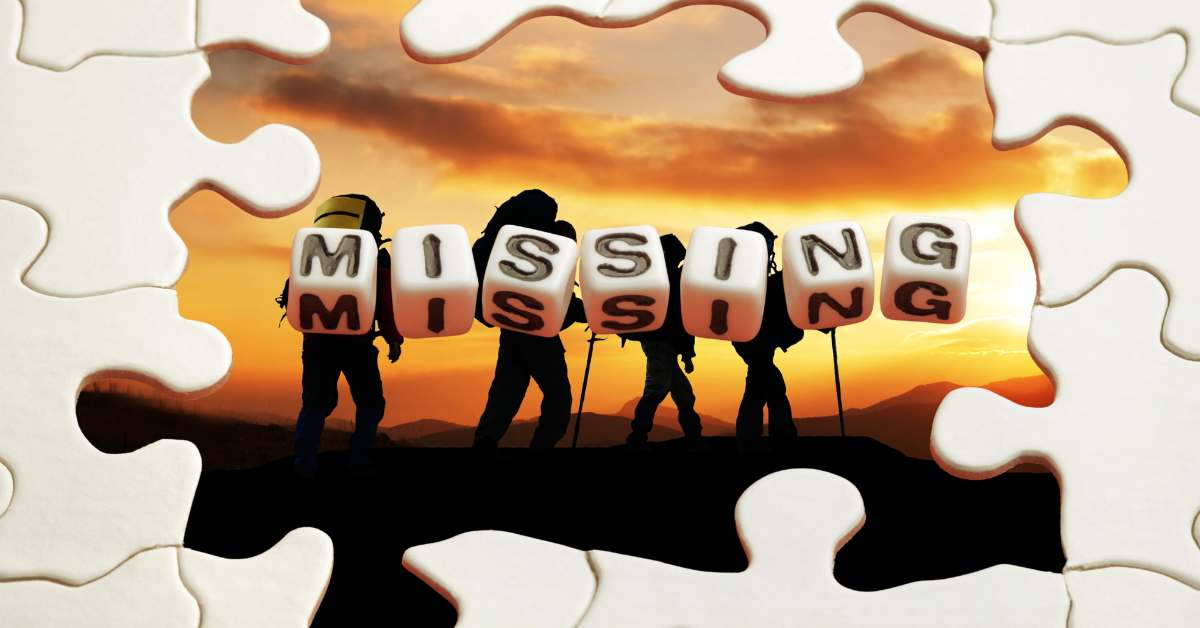 Hikers at night on Superstition Mountains with puzzle pieces and word blocks spelling out Missing