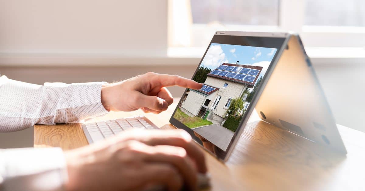 A person viewing an MLS picture of a Scottsdale home for sale on their laptop