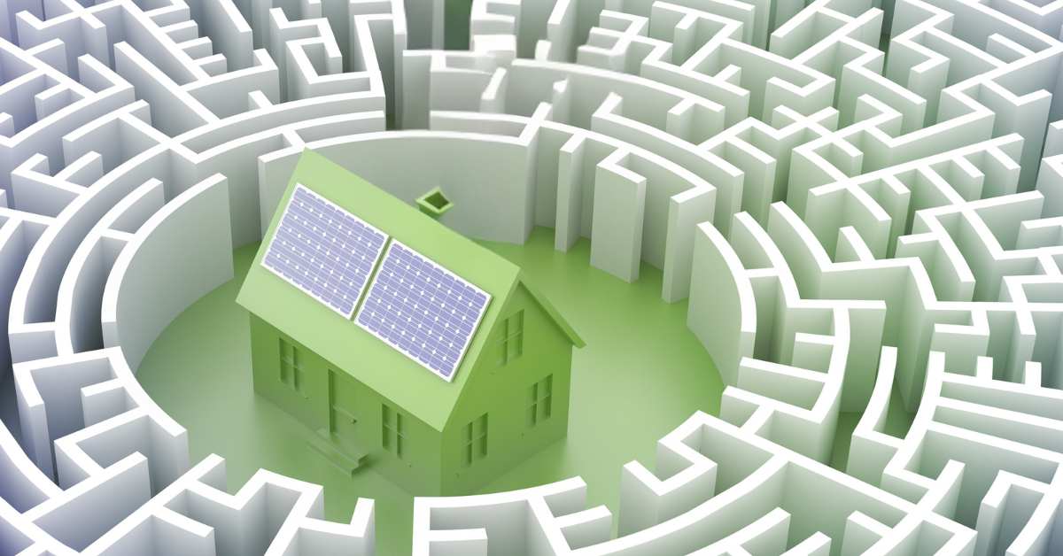 A green Scottsdale house with solar in the middle of a white maze