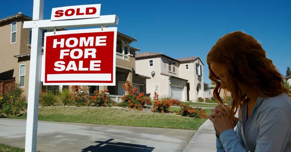 A woman waiting and praying for the right time to purchase a home for sale in Scottsdale